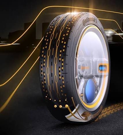Autonomous Tire | ยางรถยนต์ ราคาอัปเดต 2026 ครบทุกยี่ห้อ รวมยาง Ev | Autotirechecking Futuristic Continental tire with glowing circuit-patterns on a dark road backdrop