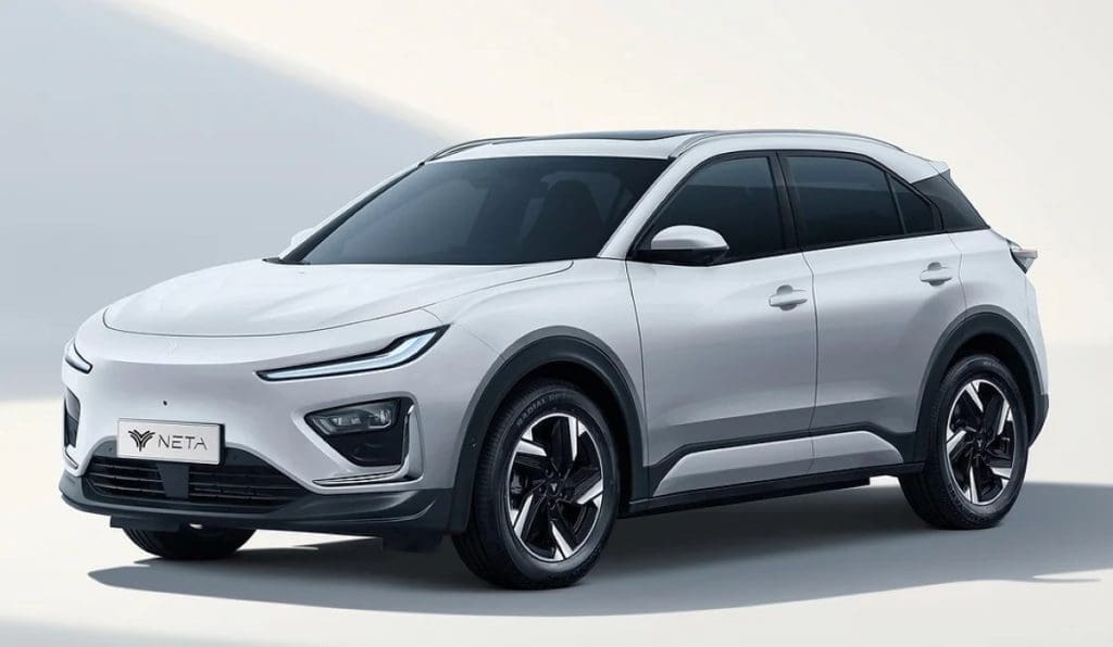 White compact SUV parked at an angle, sleek design with black-tinted windows and alloy wheels (NETA).