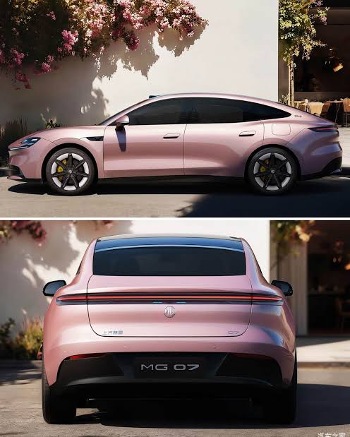 Img3895 | ยางรถยนต์ ราคาอัปเดต 2026 ครบทุกยี่ห้อ รวมยาง Ev | Autotirechecking Side and rear views of a pink MG 07 sedan parked outdoors near a flowering wall.