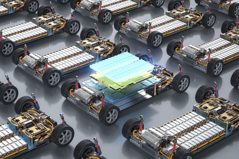 Img3921 | ยางรถยนต์ ราคาอัปเดต 2026 ครบทุกยี่ห้อ รวมยาง Ev | Autotirechecking Multiple EV battery packs mounted on chassis, with a central stack of blue-green cells highlighted in the middle.