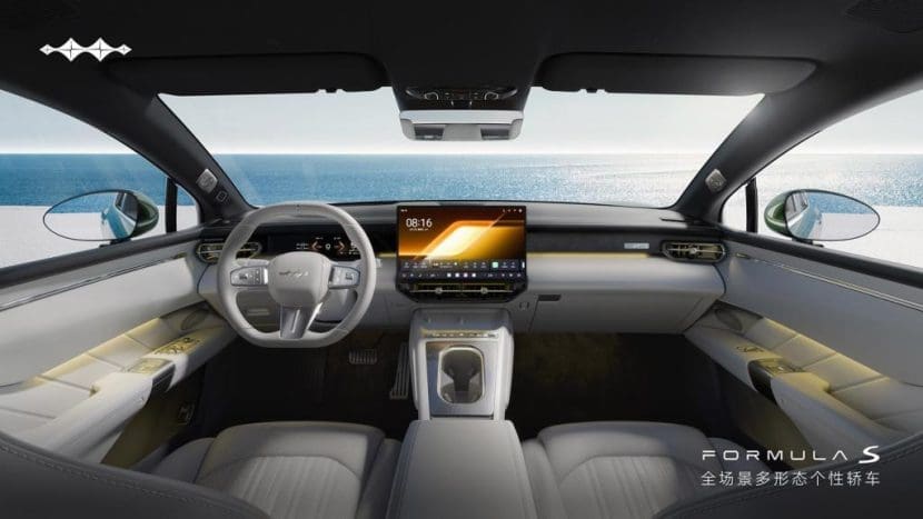 Img4440 | ยางรถยนต์ ราคาอัปเดต 2026 ครบทุกยี่ห้อ รวมยาง Ev | Autotirechecking Luxurious car cockpit with a large central touchscreen, steering wheel, and waterfront scenery visible through the windshield.