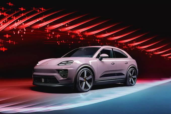 Pink SUV with sleek lines sits on a neon-lit abstract road, set against a red and blue glow backdrop.