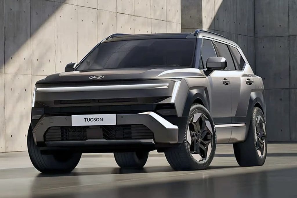 Img4865 | ยางรถยนต์ ราคาอัปเดต 2026 ครบทุกยี่ห้อ รวมยาง Ev | Autotirechecking Front three-quarter view of a gray Hyundai Tucson SUV with a dark hood and rugged bumper parked against a concrete wall, license plate reads TUCSON.