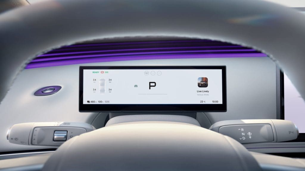 Img4930 | ยางรถยนต์ ราคาอัปเดต 2026 ครบทุกยี่ห้อ รวมยาง Ev | Autotirechecking In-car cockpit with a wide central touchscreen showing'P' parking mode and vehicle status indicators above the steering wheel.