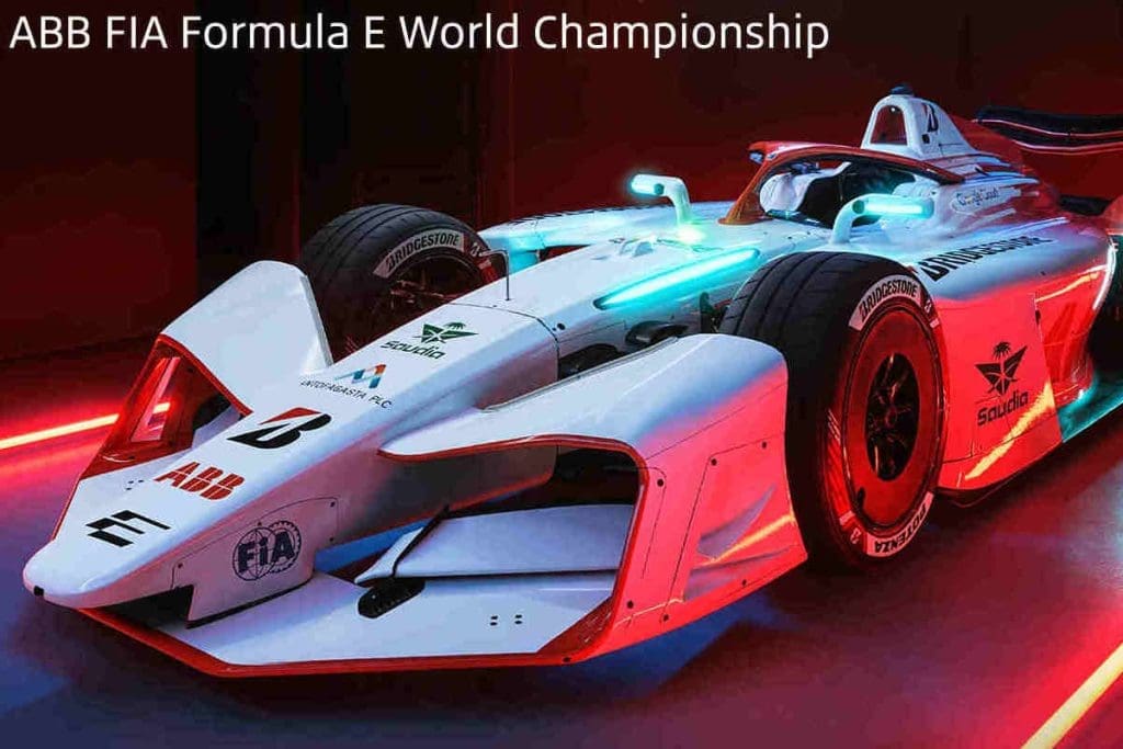Img5031 | ยางรถยนต์ ราคาอัปเดต 2026 ครบทุกยี่ห้อ รวมยาง Ev | Autotirechecking White Formula E race car with blue and red neon lighting, displaying 'ABB FIA Formula E World Championship' text above it