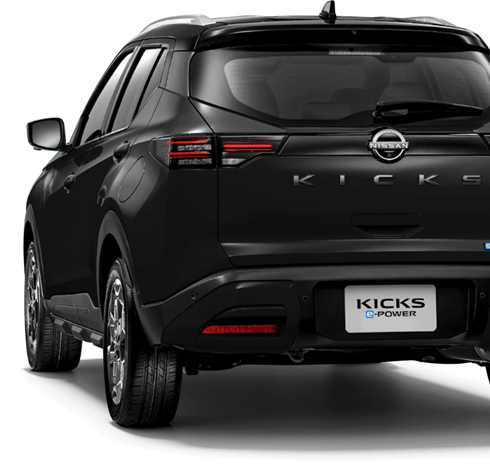 Kick 20262 | ยางรถยนต์ ราคาอัปเดต 2026 ครบทุกยี่ห้อ รวมยาง Ev | Autotirechecking Rear view of a black Nissan KICKS SUV showing the KICKS badge and taillights, with an e-POWER license area visible