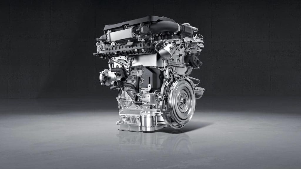 Omoda C9 Phev 20266 | ยางรถยนต์ ราคาอัปเดต 2026 ครบทุกยี่ห้อ รวมยาง Ev | Autotirechecking Modern automotive internal combustion engine displayed on a gray floor with a dark backdrop
